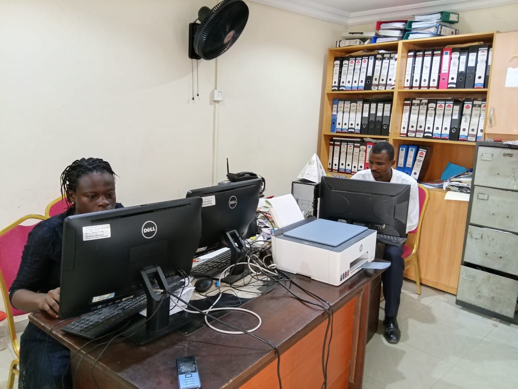 Gbagada Estate Phase II Estate members of staff at work at their desk in the Gbagada Estate Phase II Secretariat.